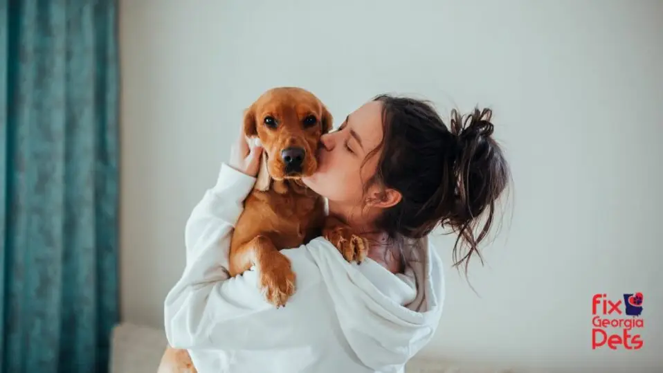 Woman hugging her companion animal.