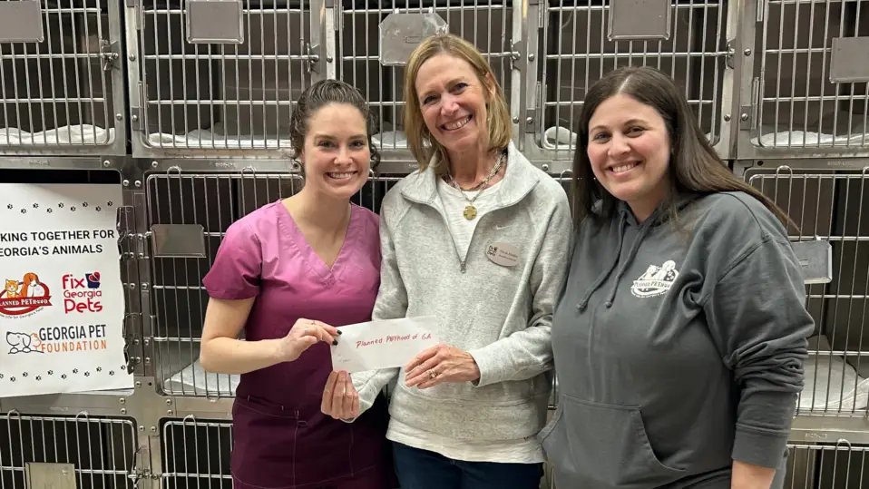 Fix Georgia Pets’ Executive Director presents Planned Pethood of Georgia with a grant for their spay neuter program